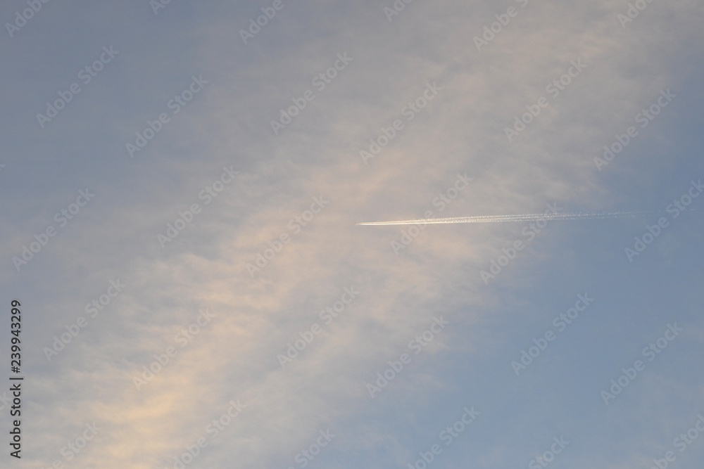 The plane flies in the evening sky The plane flies in the evening sky