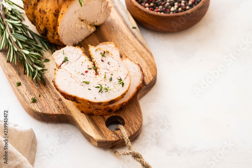 Christmas Turkey Breast Roll Stuffed with Cheese, Cranberries and Herbs, copy space.
