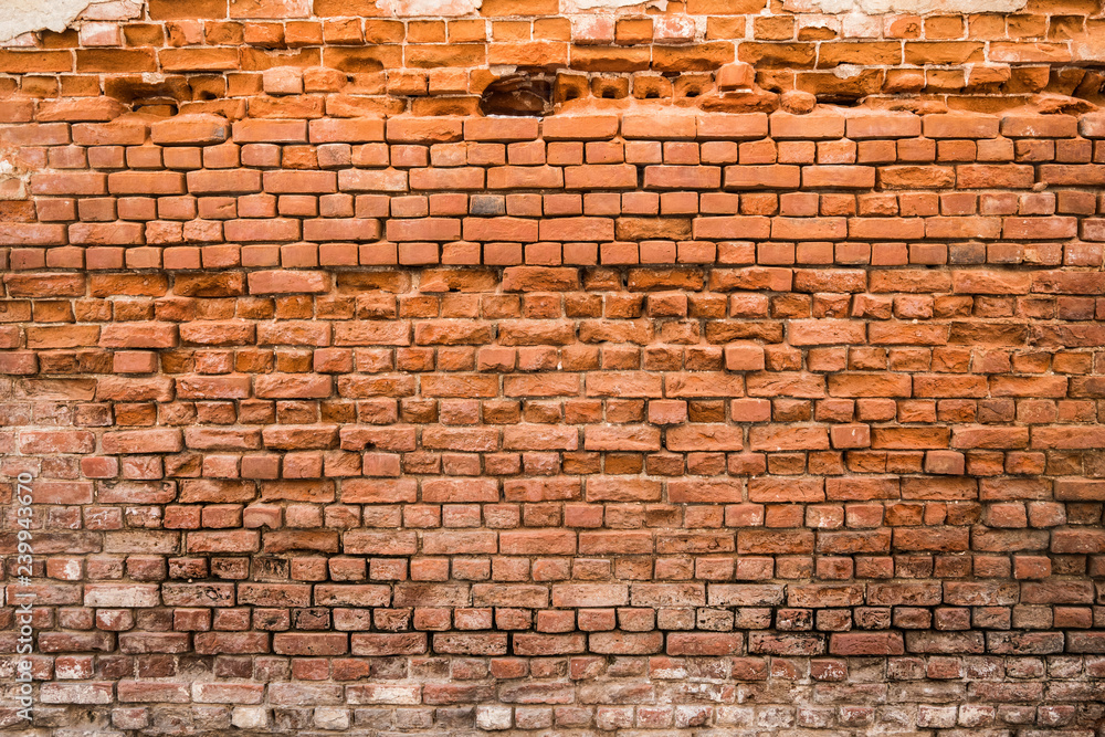 Fototapeta premium rozpadający się mur z cegły