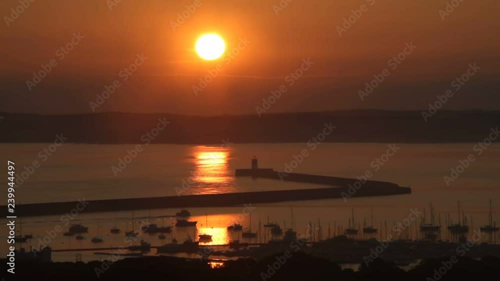 A beautiful sunrise at the port of Holyhead, located on the north-west coast of Anglesey, Wales. A beautiful sunrise at the port of Holyhead, located on the north-west coast of Anglesey, Wales.