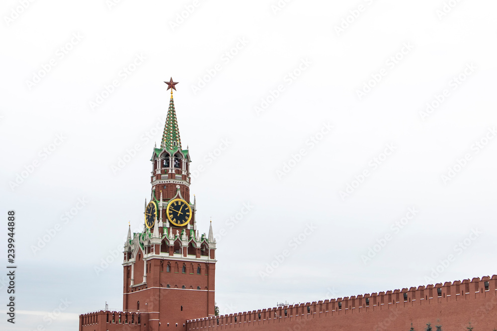 Clock tower building peak in Kremlin, Moscow isolated on a white cloudy background Clock tower building peak in Kremlin, Moscow isolated on a white cloudy background