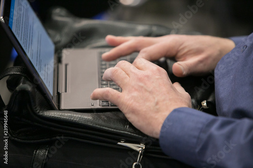 Hands on a laptop keyboard - a journalist, writer or a programmer at work
