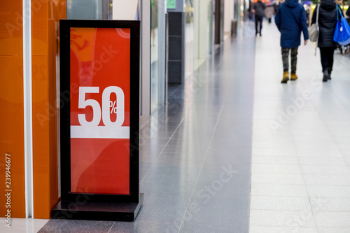 Shopping sale. seasonal half price discount on clothes.shopping mall,center,Sale label sign in front of shop,Sale shopping season for discount display,marketing business advertisement for clearance