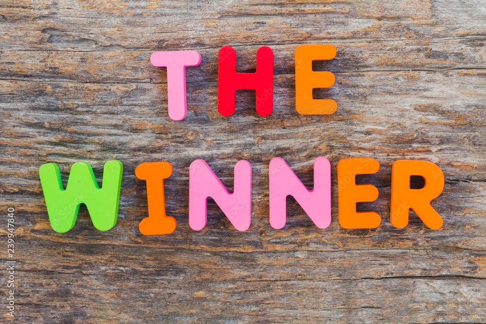 Fototapeta premium The wooden letter came in the word The Winner