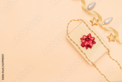 gifts boxes or presents boxes with red bows, star and ball on golden background for birthday, christmas or wedding ceremony