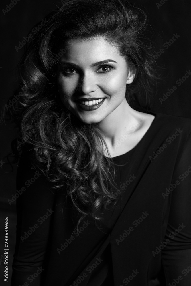 Happy and elegant woman portrait studio shot black and white. Attractive adult brunette sexy girl on black background. Long beautiful healthy hair model girl stock image. Happy and elegant woman portrait studio shot black and white. Attractive adult brunette sexy girl on black background. Long beautiful healthy hair model girl stock image.
