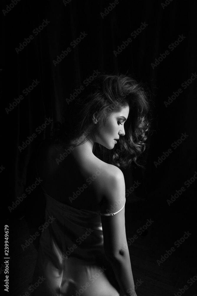 Happy and elegant woman portrait studio shot black and white. Attractive adult brunette sexy girl on black background. Long beautiful healthy hair model girl stock image.