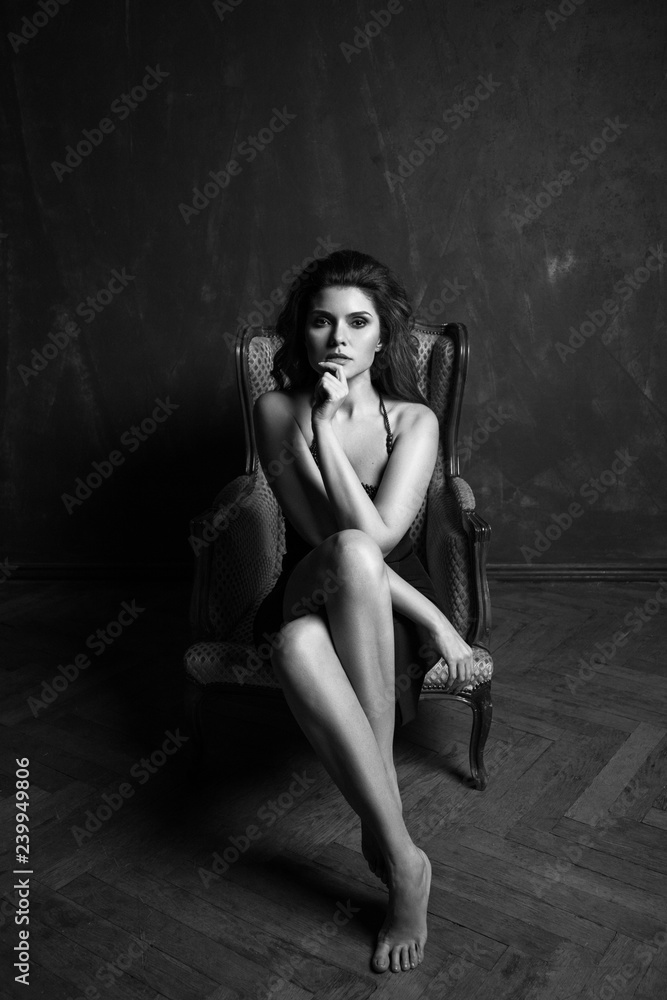Happy and elegant woman portrait studio shot black and white. Attractive adult brunette sexy girl on black background. Long beautiful healthy hair model girl stock image. Happy and elegant woman portrait studio shot black and white. Attractive adult brunette sexy girl on black background. Long beautiful healthy hair model girl stock image.