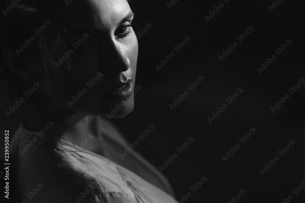 Elegant woman portrait studio shot black and white. Attractive adult brunette sexy girl on black background. Long beautiful healthy hair model girl stock image.