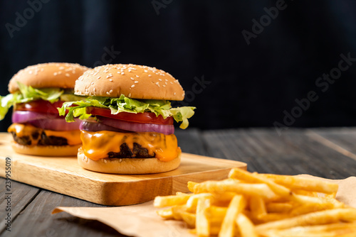 fresh tasty beef burger with cheese and french fries