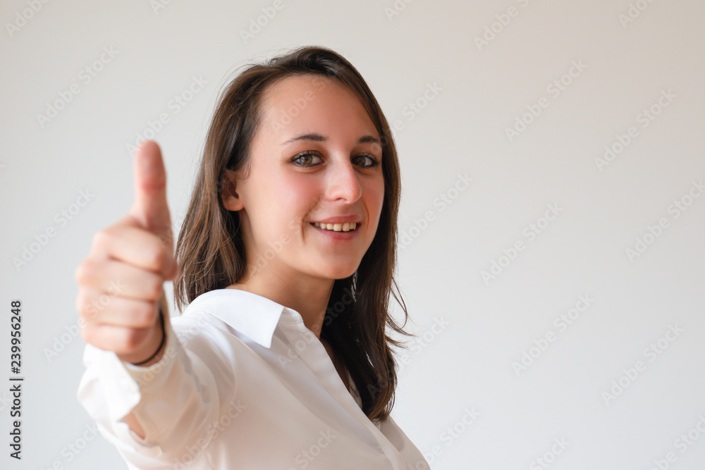 Satisfied customer approving product or store. Positive confident young woman showing thumb up and gesturing like. Recommendation concept Satisfied customer approving product or store. Positive confident young woman showing thumb up and gesturing like. Recommendation concept