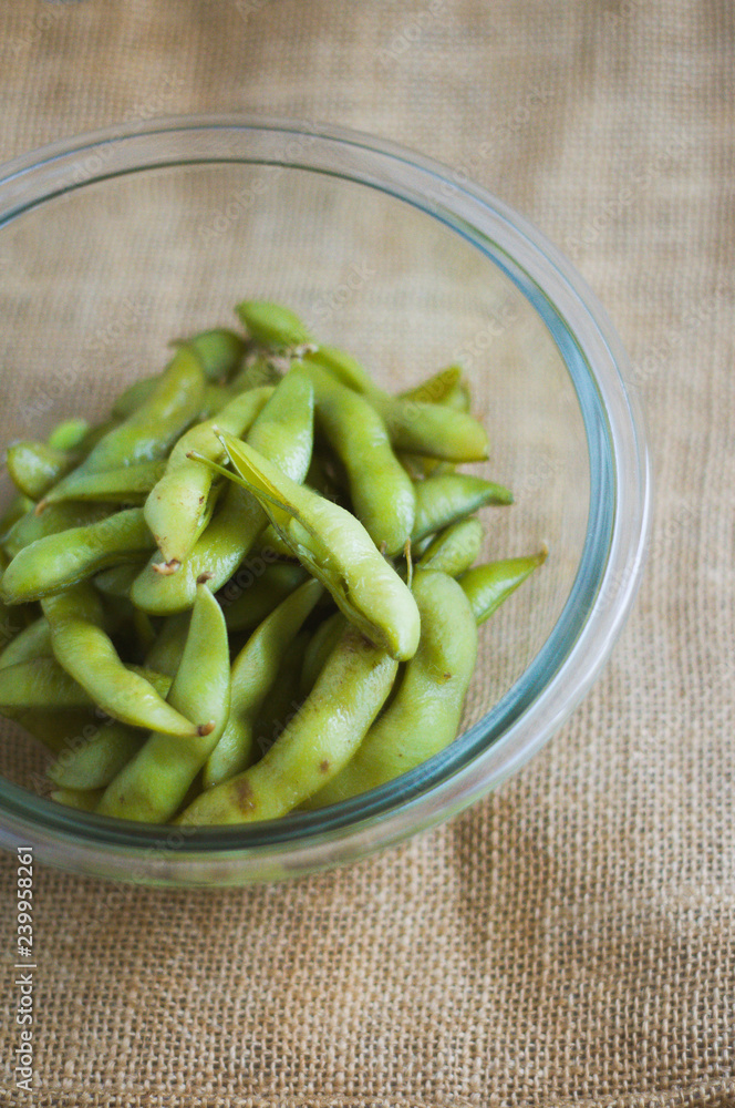 close up portrait of Japanese food edamame nibbles, boiled green soybeans close up portrait of Japanese food edamame nibbles, boiled green soybeans
