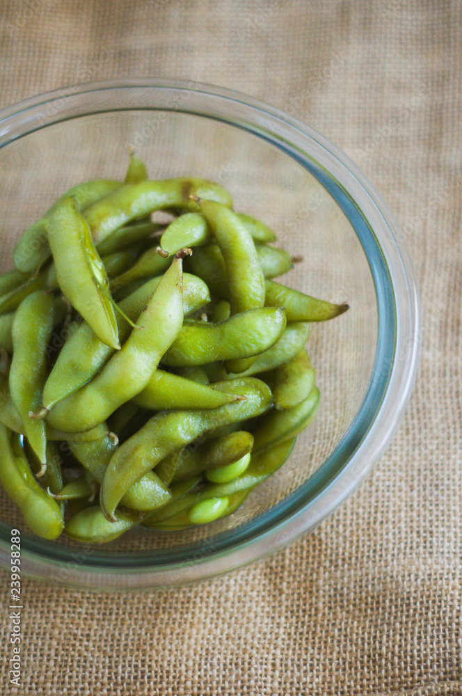 close up portrait of Japanese food edamame nibbles, boiled green soybeans close up portrait of Japanese food edamame nibbles, boiled green soybeans