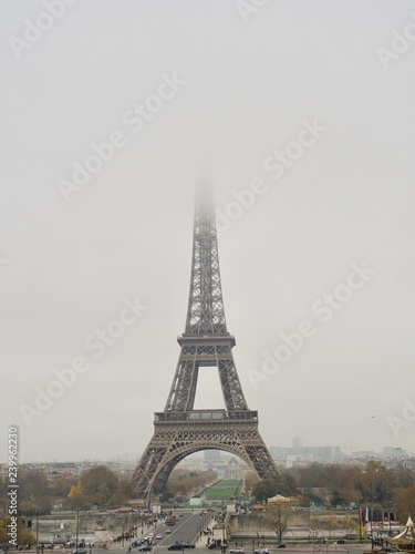 Fototapeta Naklejka Na Ścianę i Meble -  A beautiful illuminated Eiffel Tower and misty night street in Paris, France - Image