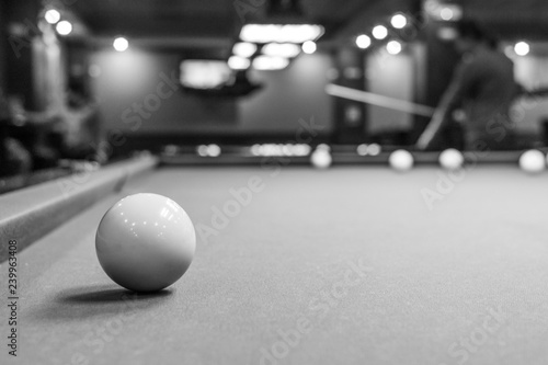 The game of American and Russian billiards. Pool table  ball and cue. Sports leisure. Friendly tournament. Winter fun. Green cloth in billiards. Luza for the ball. Aim and beat. Cue kick.