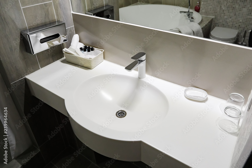 Fototapeta premium Bathroom interior with white sink and faucet