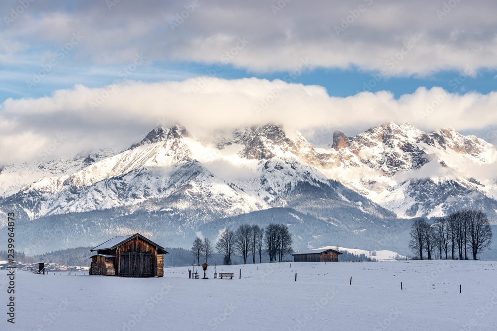 Snowy mountains, meadow and a hut, landscape in Austria