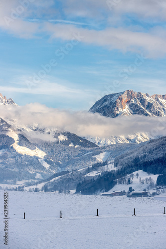 Snowy mountains, meadow and fence, landscape in Austria, panorama
