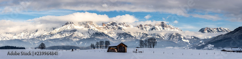 Snowy mountains, meadow and a hut, landscape in Austria, panorama