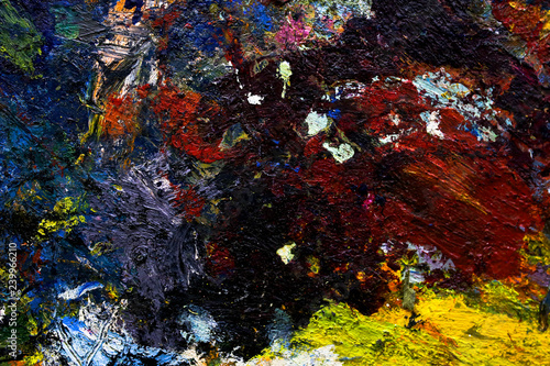 Fototapeta Naklejka Na Ścianę i Meble -  multi-colored strokes of oil paint on the artist's palette. background