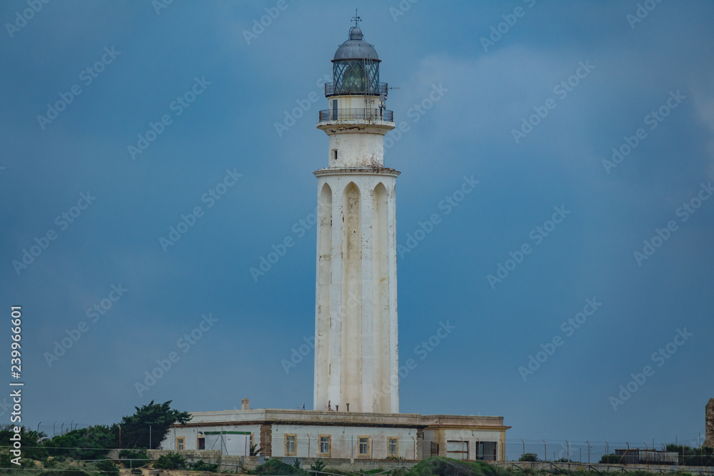 Trafalgar lighthouse in a dark cloudy day