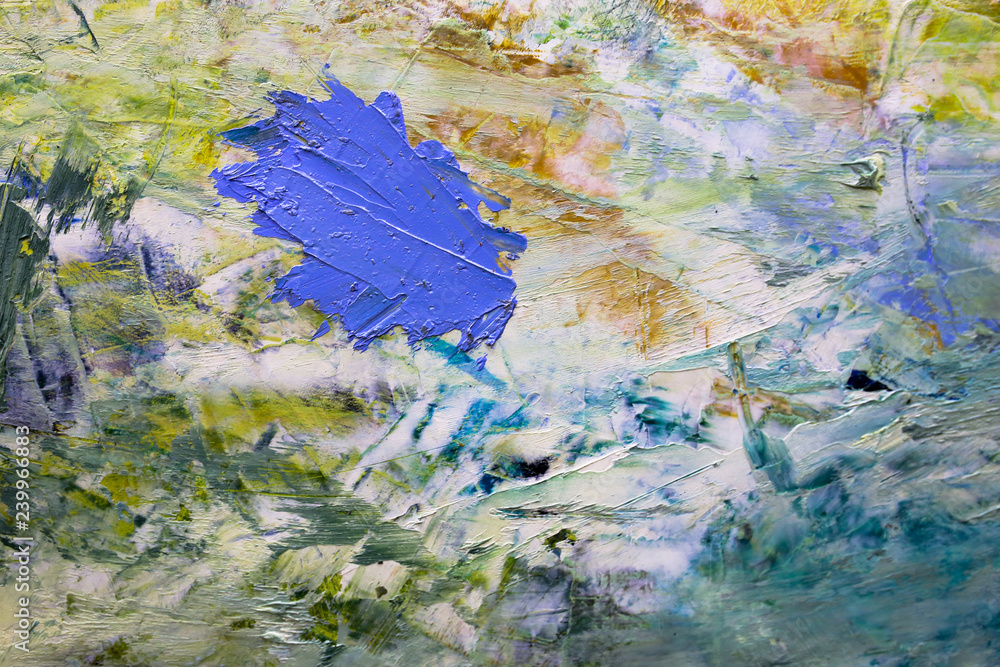 multi-colored strokes of oil paint on the artist's palette. background multi-colored strokes of oil paint on the artist's palette. background
