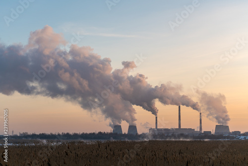 Bild auf Leinwand Pipes with heavy smoke in the industrial city in winter, Chelyabinsk, Russia