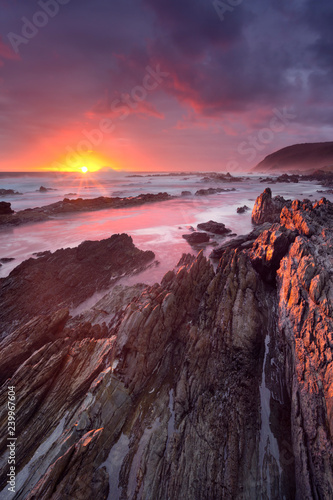 Sunset over the ocean in Garden Route NP, South Africa