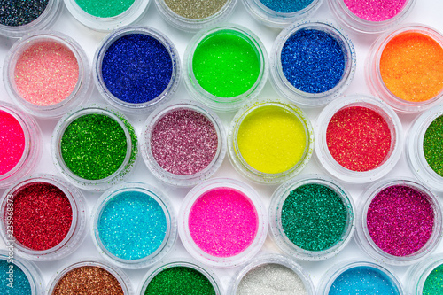 Color glitter. Shimmer, sparkle. For makeup, manicure and decorating clothes. Beautiful bright background. Cosmetic, beauty products. Multicolored eyeshadow