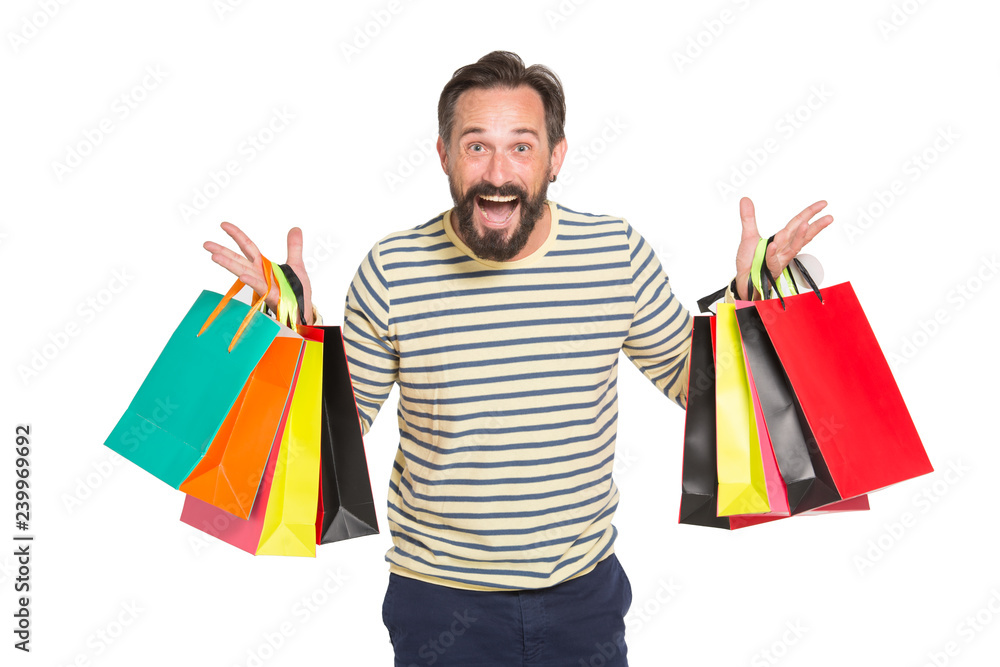 Φωτογραφία Waist up of delighted shopaholic holding paper shopping bags with purchases