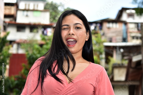 Winking Youthful Minority Female