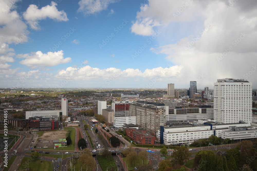 Fototapeta premium Overview over the city of Rotterdam in the Netherlands with its harbors and bridges over the river Oude Maas.