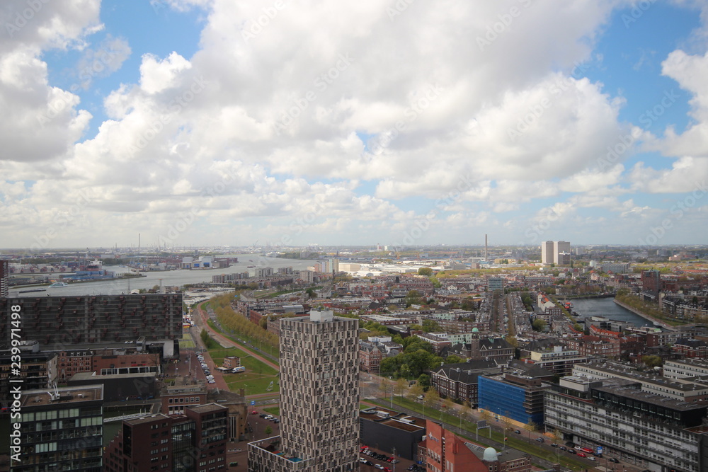 Overview over the city of Rotterdam in the Netherlands with its harbors and bridges over the river Oude Maas.