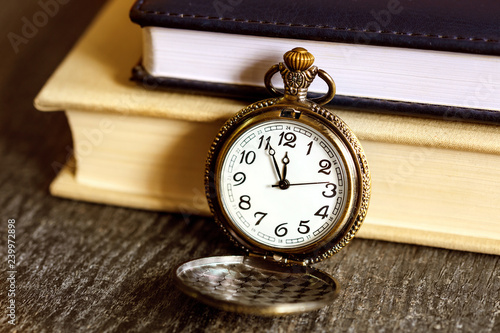 Vintage pocket watch with books