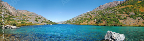 Alpine turquoise lake in autumn on a sunny day