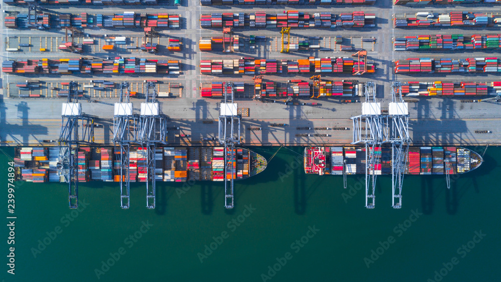 Container ship carrying container for import and export, Aerial view business logistic and freight transportation by ship in open sea.