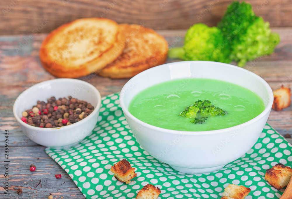 Bowl of cream of broccoli soup. Concept of healthy eating or vegetarian food Bowl of cream of broccoli soup. Concept of healthy eating or vegetarian food