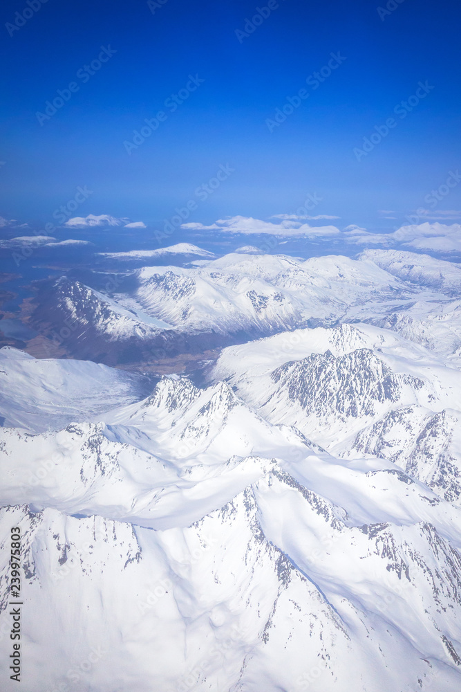 Obraz premium Aerial view of snowy Norway from the plane