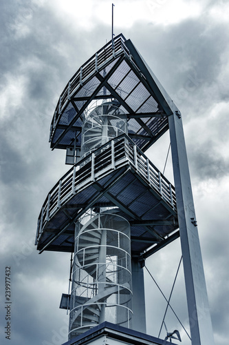 Lookout tower high in the mountains. Metal frame building photo