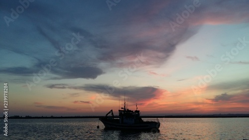 Sunset in Spain.  Harvor, boat, sky photo