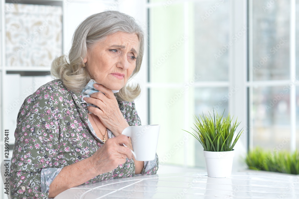 Close up portrait of senior woman taking medicine Close up portrait of senior woman taking medicine