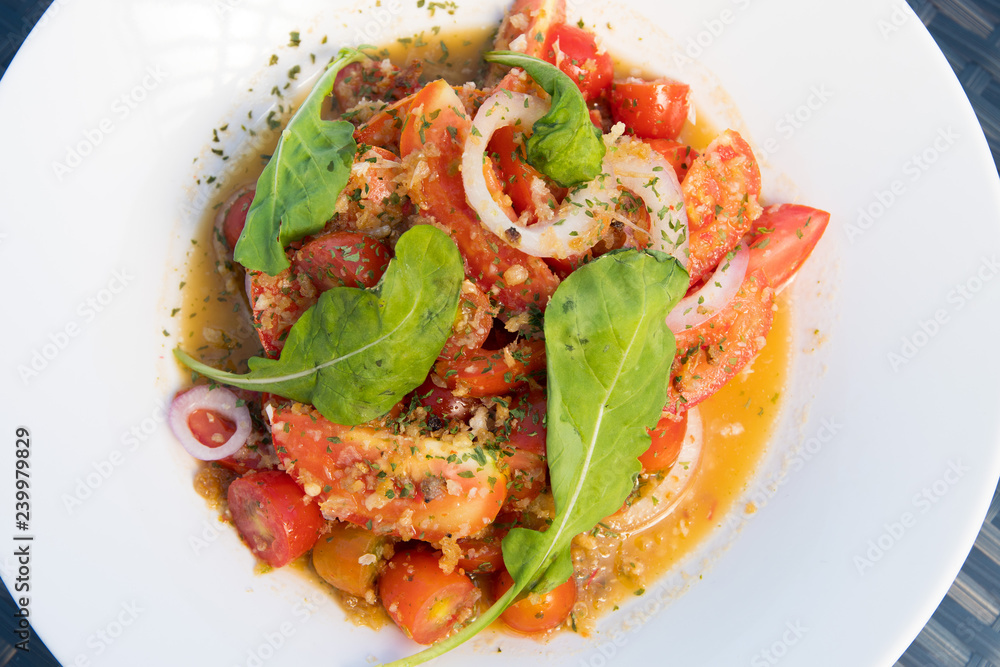 Marinated Tomato Salad with green leaf veggie, Fusion food stylish arrange on glass table along ocean mangrove tree Island, empty copy space for text logo Yummy Marinated Tomato Salad with green leaf veggie, Fusion food stylish arrange on glass table along ocean mangrove tree Island, empty copy space for text logo Yummy