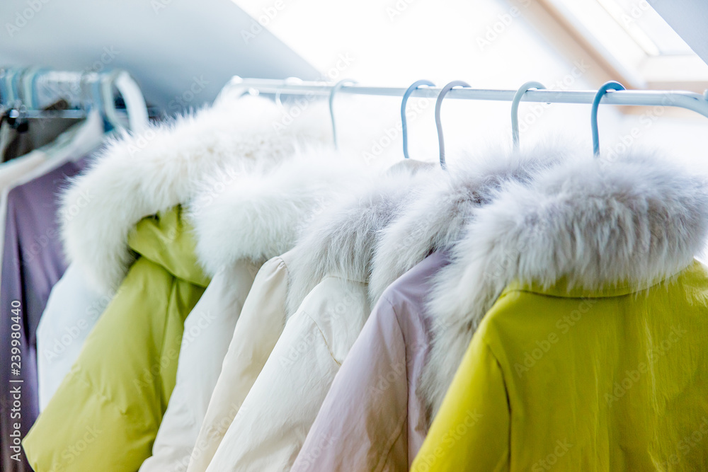 Winter clothing and coat hanger hi-res stock photography and