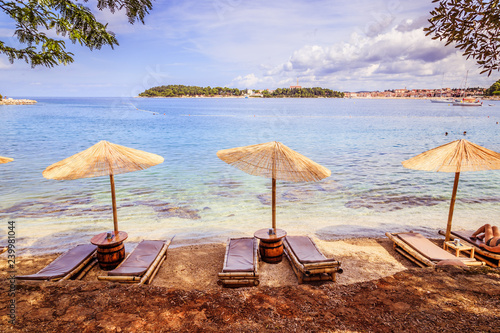 Fototapeta Naklejka Na Ścianę i Meble -  Sunshade and sunlounger on a beach, Lone Bay, Croatia