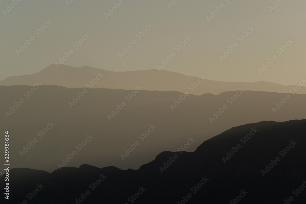 Mountain layers of the andean precordillera pre-mountain range and the cordillera at sunset, San Juan, Argentina