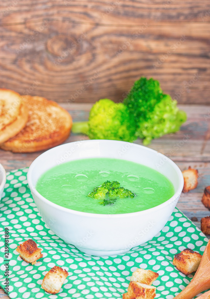 Bowl of cream of broccoli soup. Concept of healthy eating or vegetarian food Bowl of cream of broccoli soup. Concept of healthy eating or vegetarian food