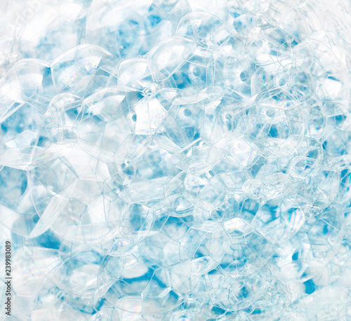 Abstract background of blue soap bubbles. Concept of cleansing