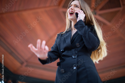 Young businesswoman having phone argument