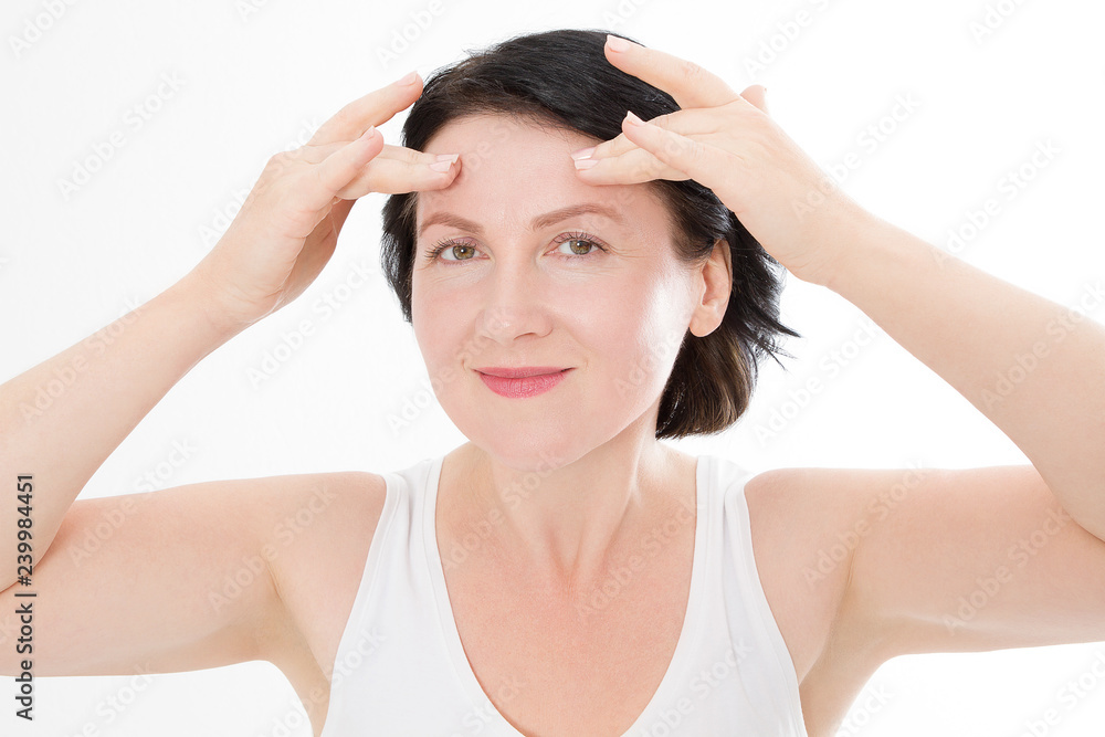 Macro Woman face with wrinkles on the forehead. Collagen and face injections concept. Menopause. Cropped image. Copy space and mock up. Plastic surgery Macro Woman face with wrinkles on the forehead. Collagen and face injections concept. Menopause. Cropped image. Copy space and mock up. Plastic surgery