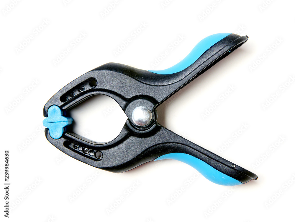 Plastic carpentry clamp on a white background. Plastic carpentry clamp on a white background.